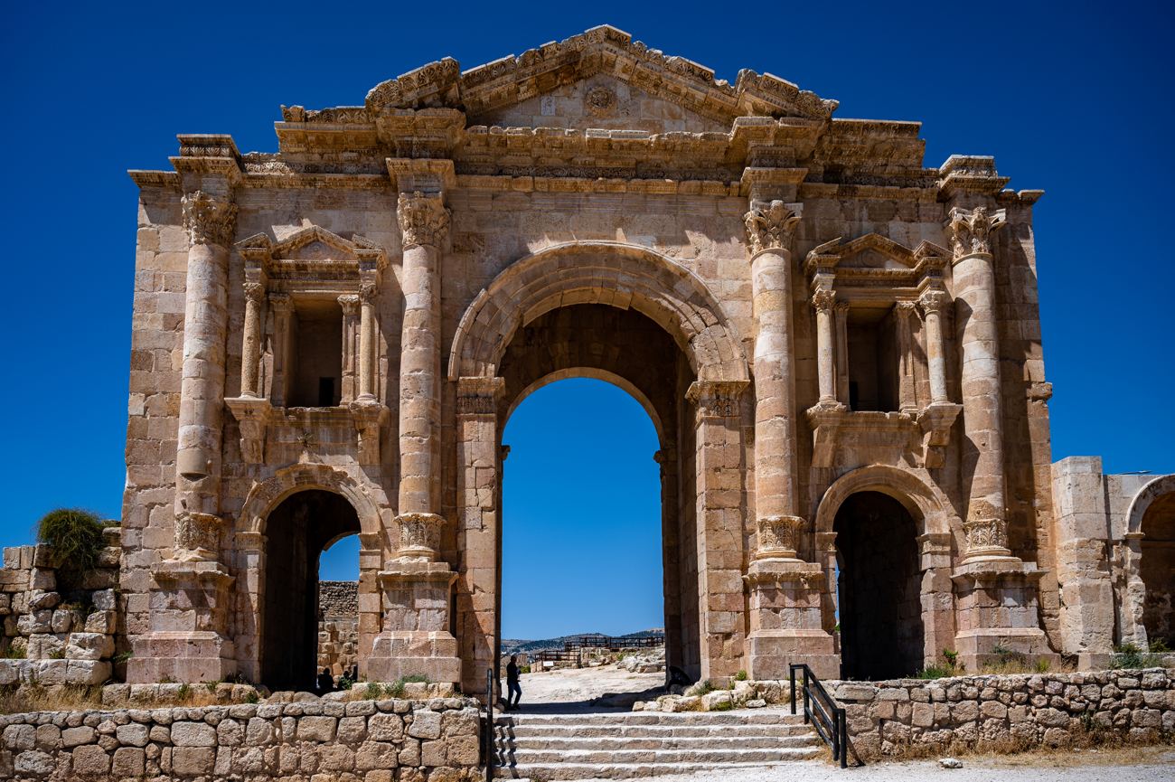 Hadrian's Arch standing against a blue sky at Jerash, Jordan